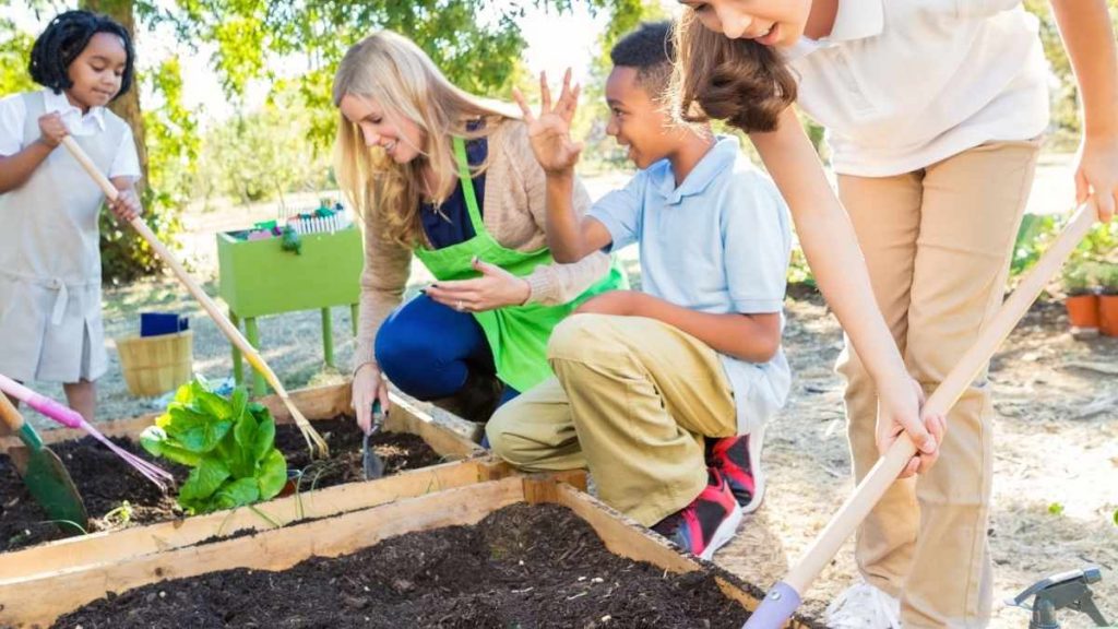 kids planting in a garden