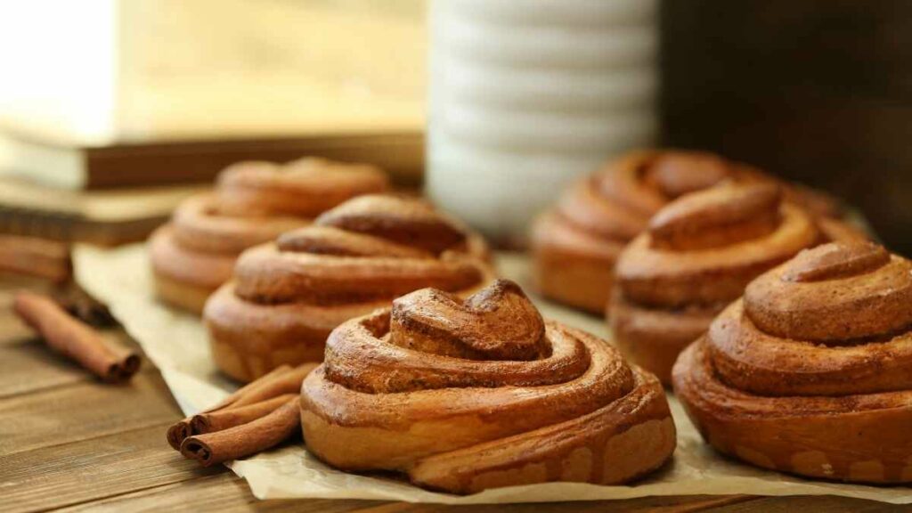 parchment paper with cinnamon whirls on