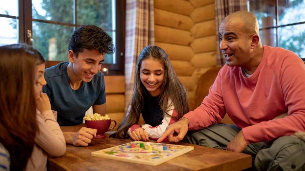 family playing board game