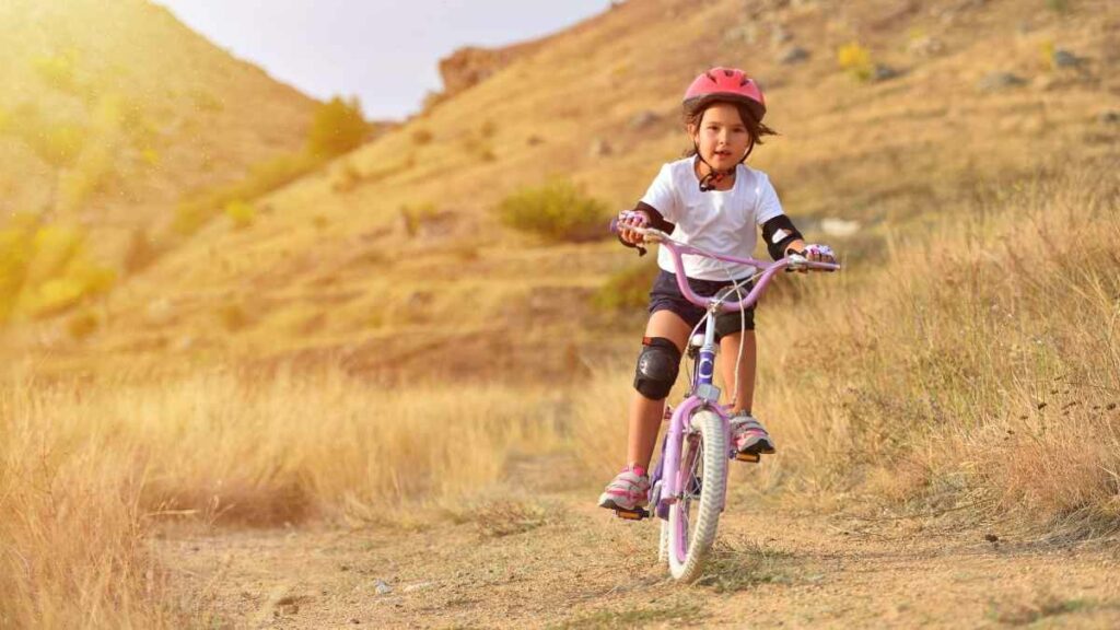 kid on push bike