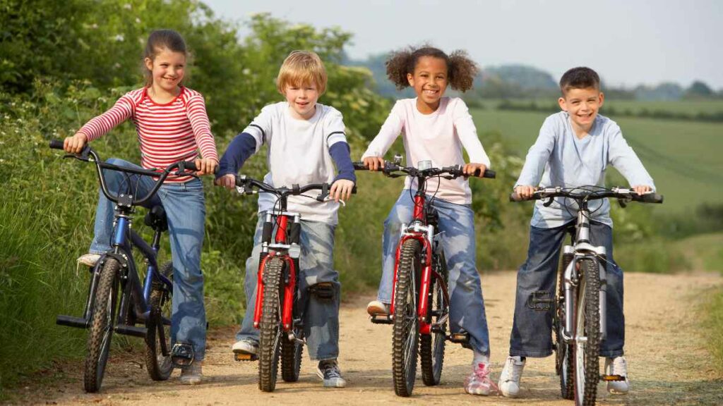 kids riding bikes - green transport